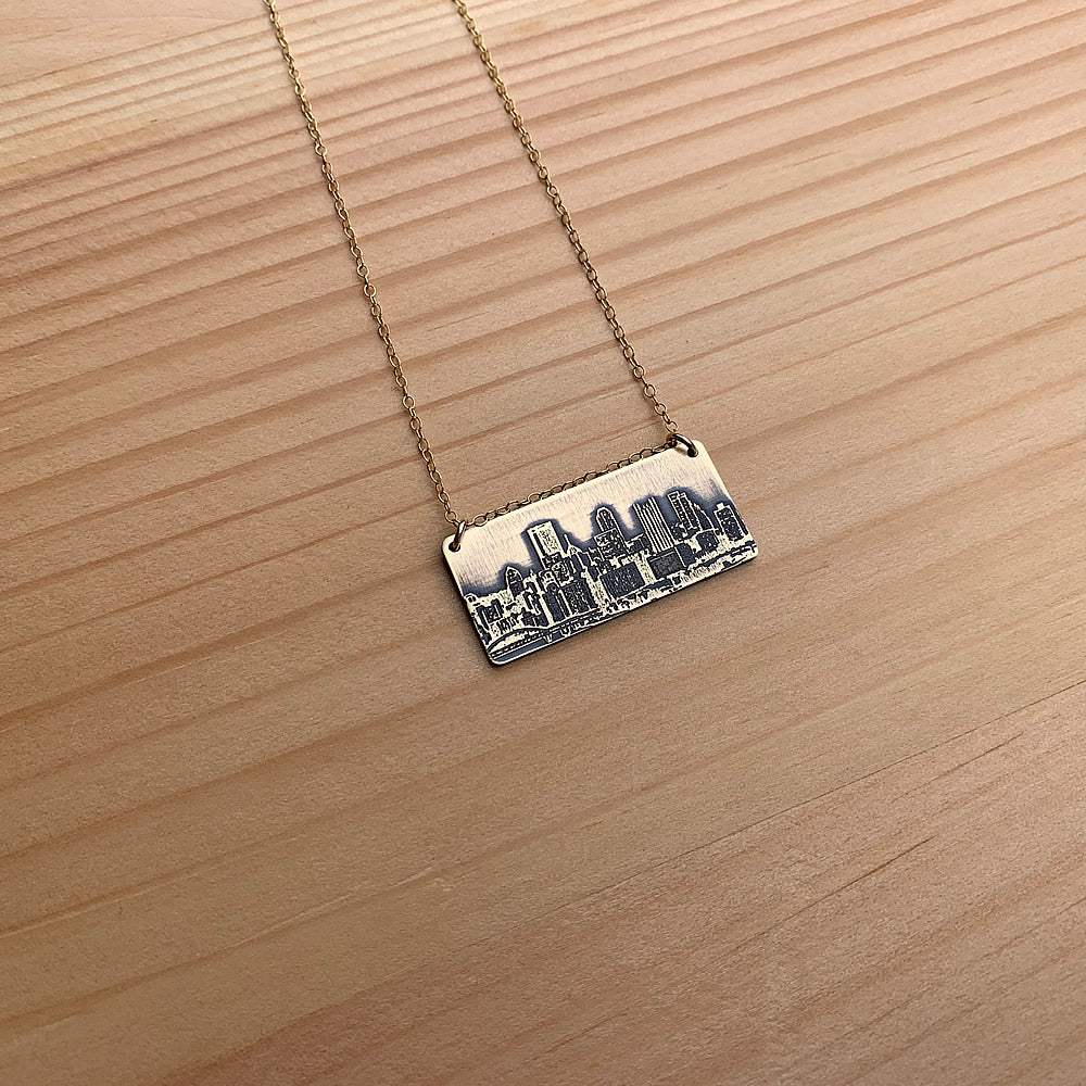 brass pittsburgh skyline pendant with gold filled chain handmade jaci riley jewelry