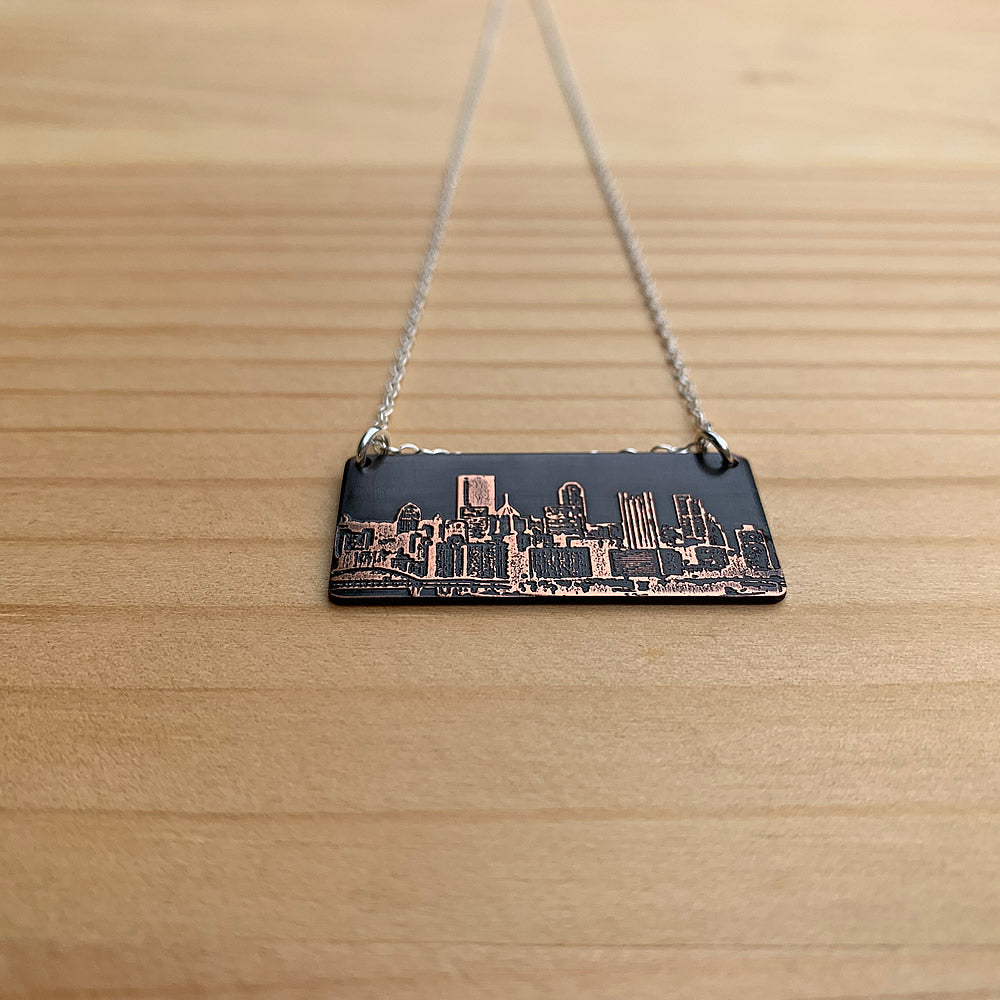 dark copper pittsburgh skyline pendant close up