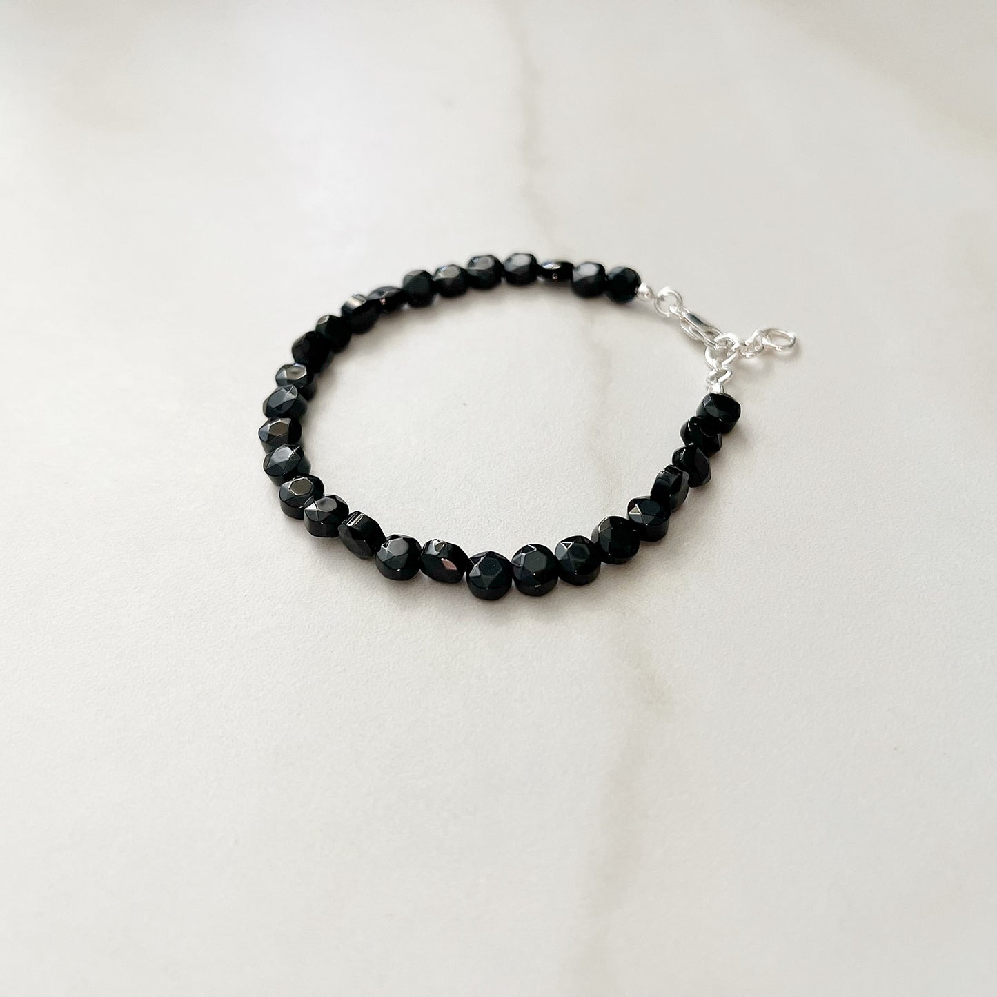 single strand onyx bracelet with sterling silver hardware