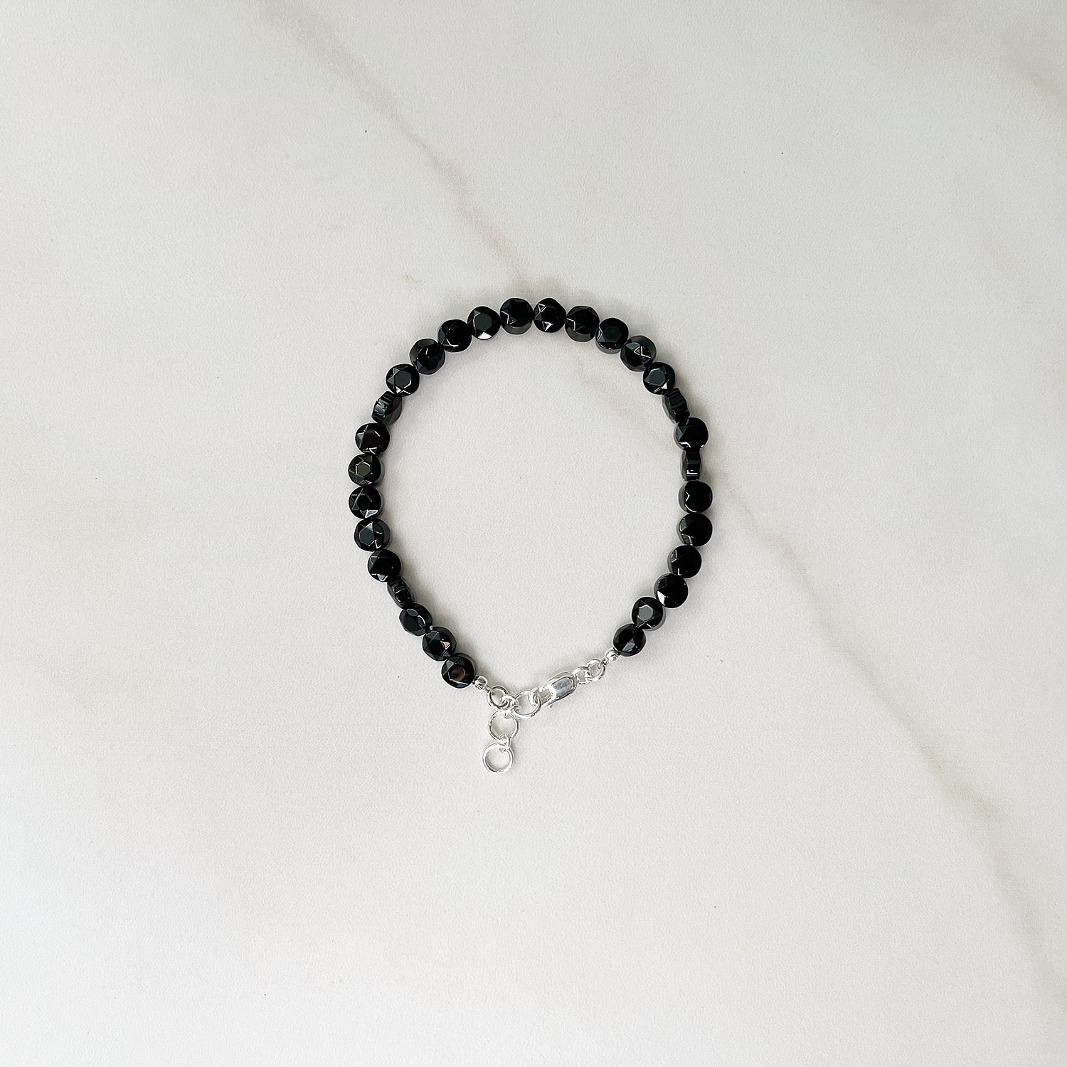 single strand onyx bracelet with sterling silver hardware
