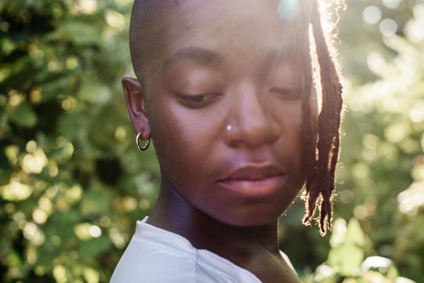 silver hoops on a model with a white t shirt