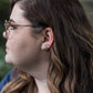 cube studs modeled on a woman