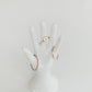 stacking rings on hand statue in gold