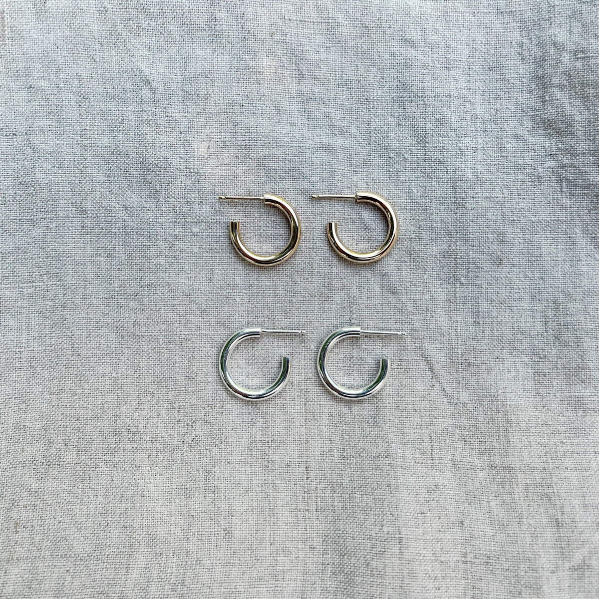 14k gold filled and sterling silver hoops on linen cloth
