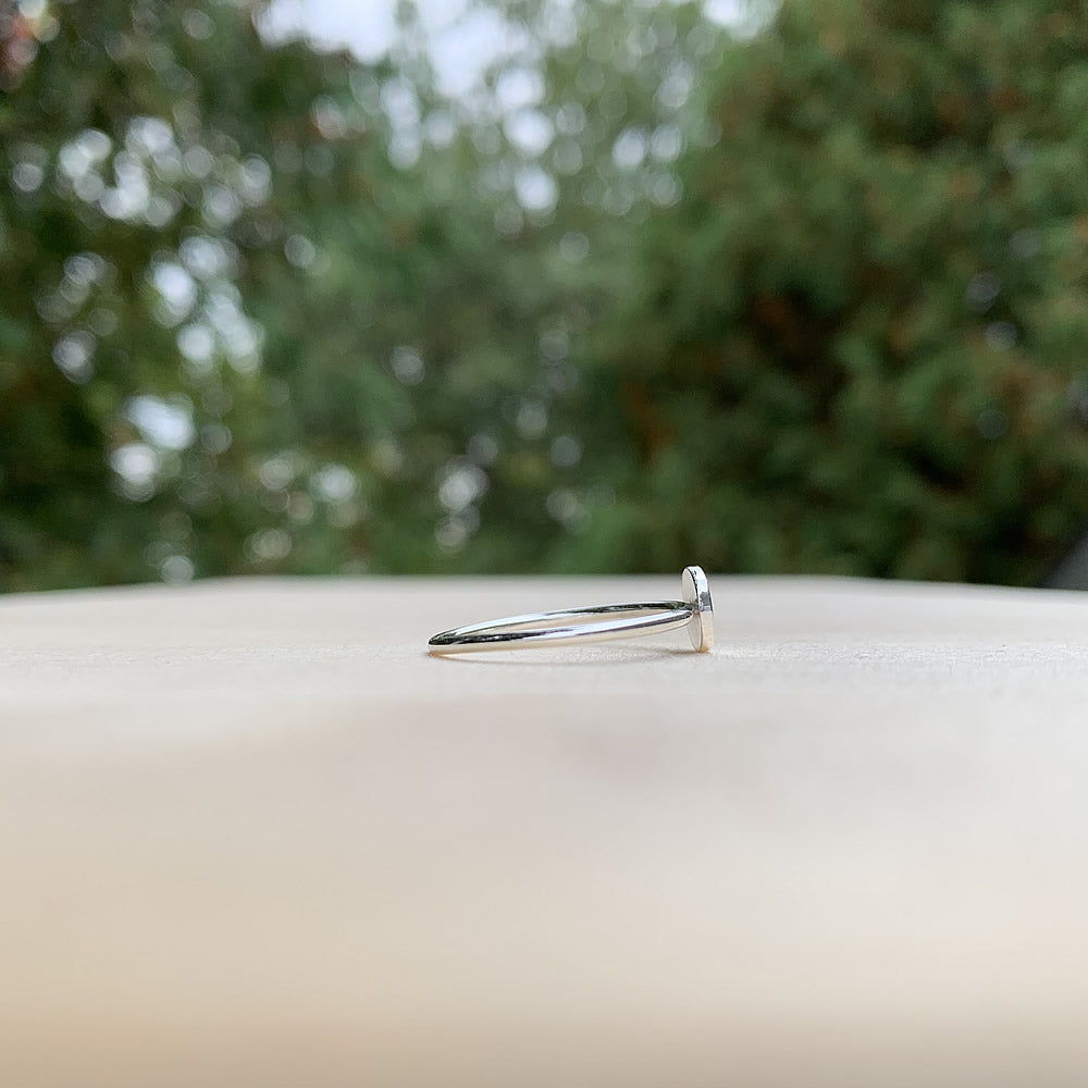 side view of sterling silver cringe face ring