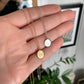 gold vermeil and sterling silver great lakes pendant on a hand