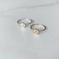Letter A and letter J stacking rings in gold and silver