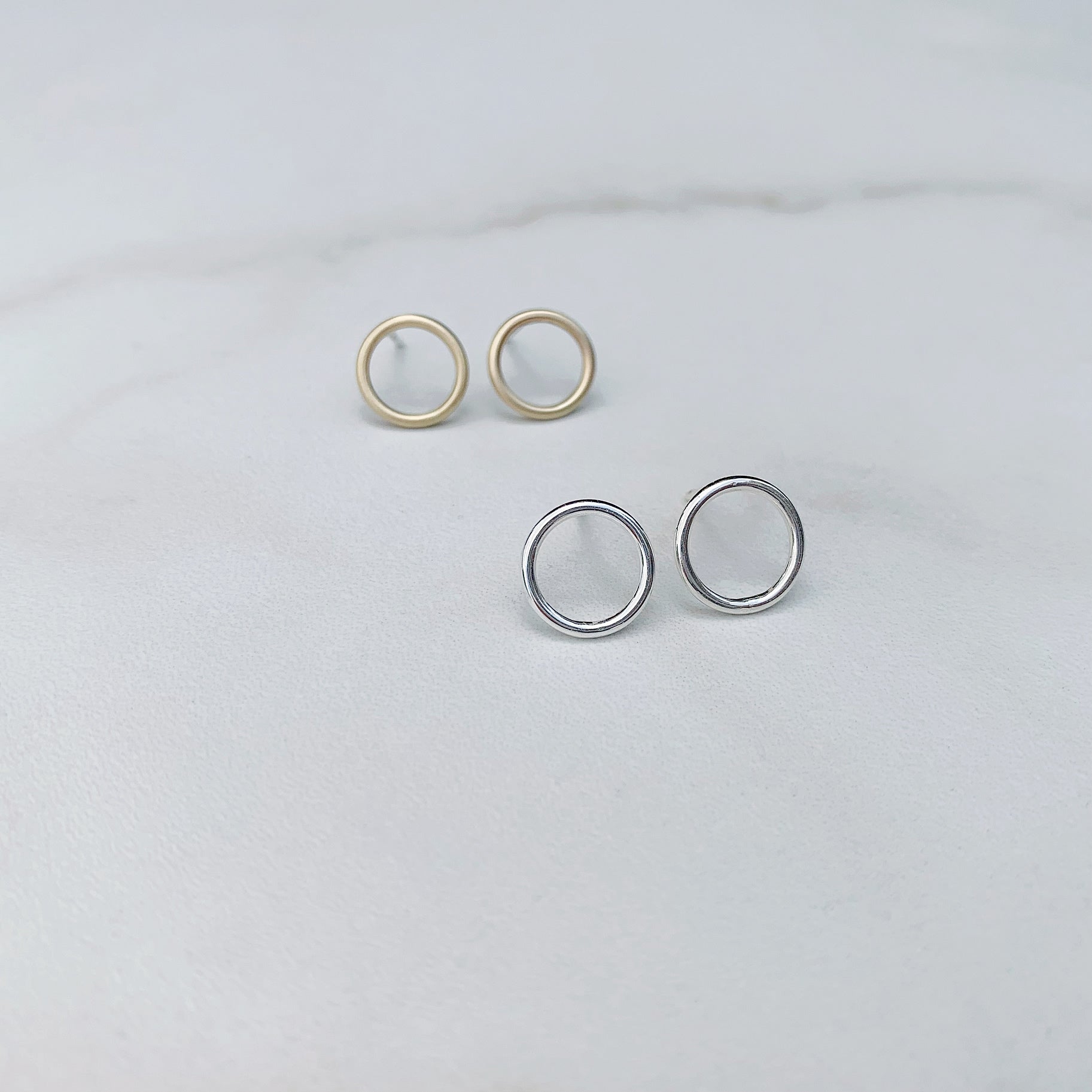 open circle studs in sterling silver and brass