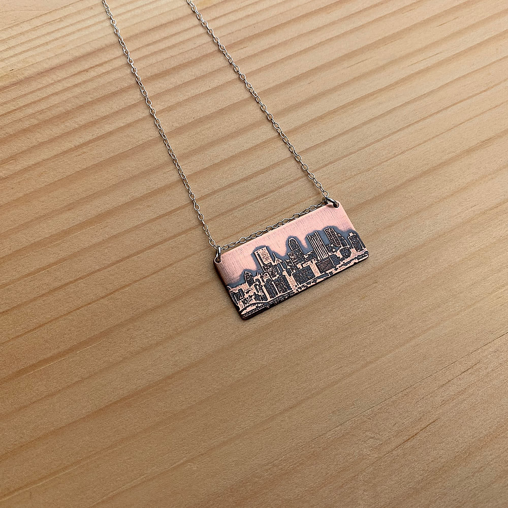 copper pittsburgh skyline pendant with sterling silver chain handmade jaci riley jewelry