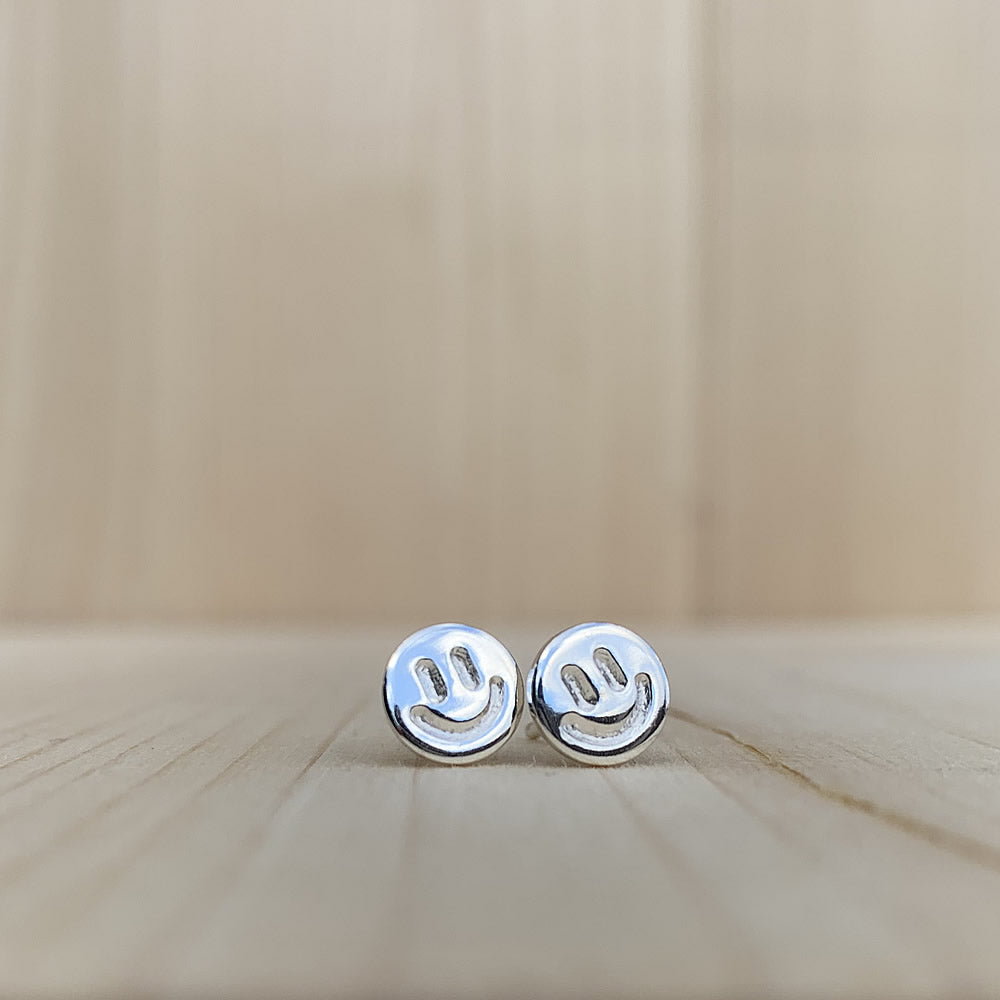 shiny silver smiley face earrings handmade by jaci riley jewelry