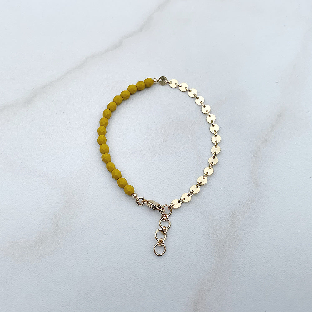 beaded bracelet with yellow glass beads and gold coin chain