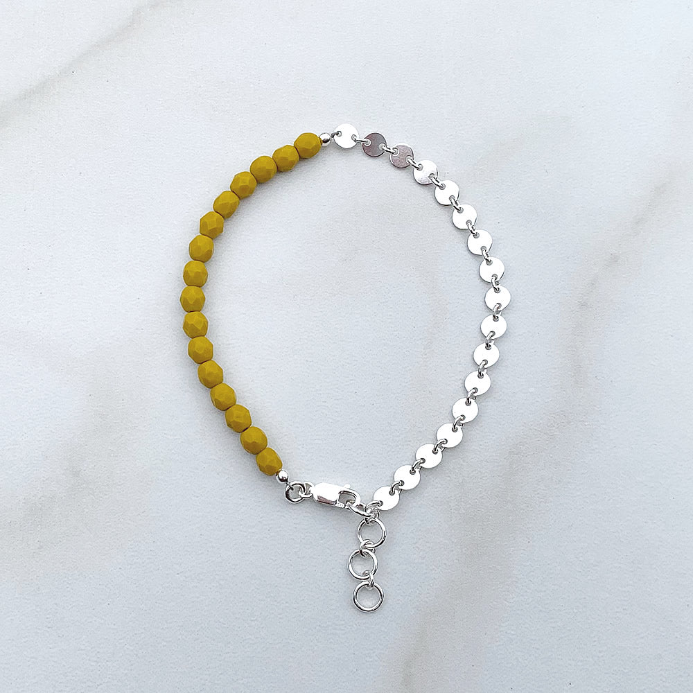 beaded bracelet with yellow glass beads and silver coin chain